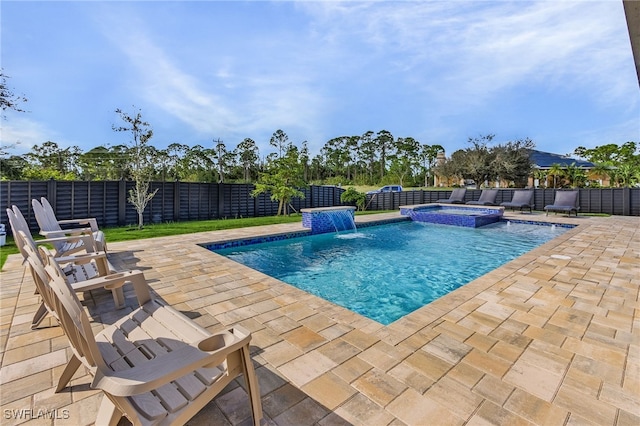 view of swimming pool with pool water feature, an in ground hot tub, and a patio