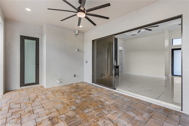 view of patio featuring ceiling fan