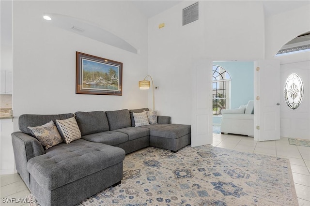 2819 SW 37th Ter, Cape Coral, FL 33914 - tiled living room featuring a high ceiling