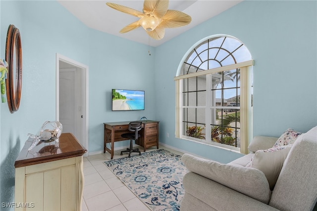 interior space with ceiling fan and light tile patterned flooring