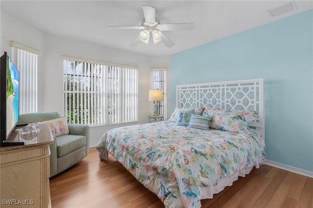 2819 SW 37th Ter, Cape Coral, FL 33914 - bedroom featuring wood finished floors, baseboards, and ceiling fan
