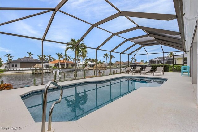 2819 SW 37th Ter, Cape Coral, FL 33914 - swimming pool with a patio, a water view, a boat dock, and glass enclosure