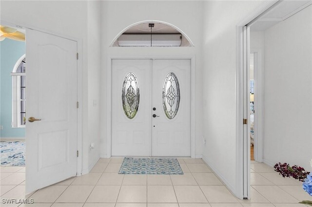 2819 SW 37th Ter, Cape Coral, FL 33914 - entryway with light tile patterned flooring and baseboards
