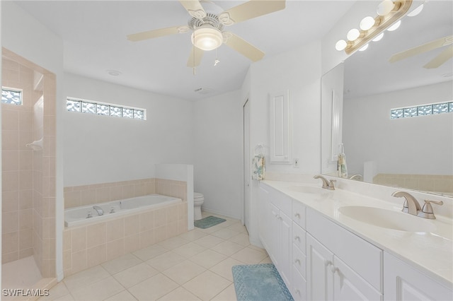 full bathroom featuring vanity, tile patterned floors, ceiling fan, separate shower and tub, and toilet