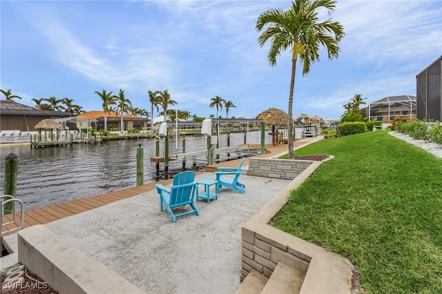 view of dock featuring a lawn and a water view