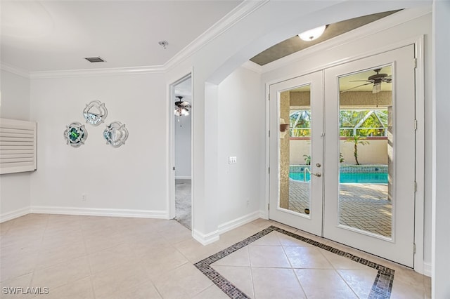 doorway to outside featuring french doors, ceiling fan, and crown molding