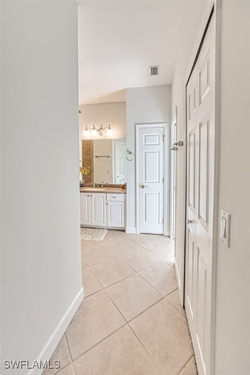 hallway with light tile patterned floors