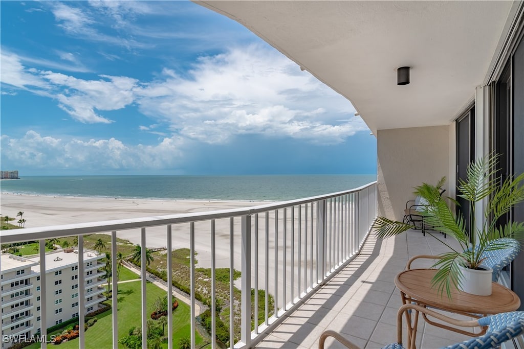 balcony with a view of the beach and a water view