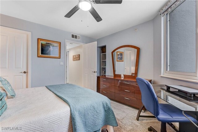 bedroom featuring ceiling fan and light colored carpet