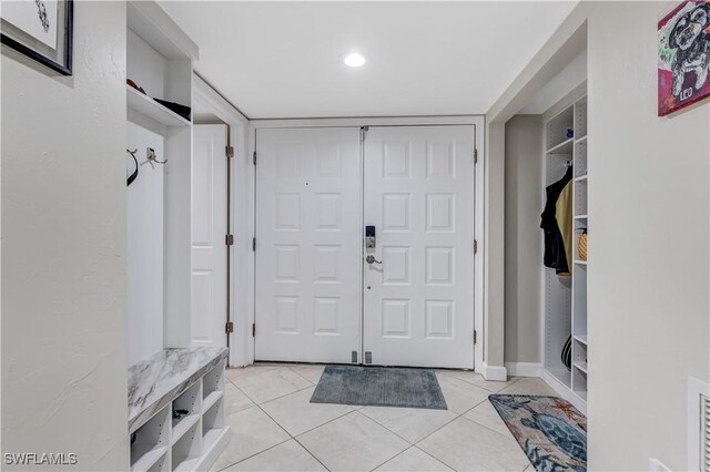 mudroom featuring light tile patterned floors