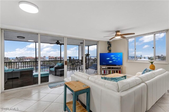 tiled living room with ceiling fan