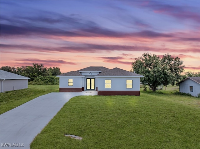 view of front of home with a yard