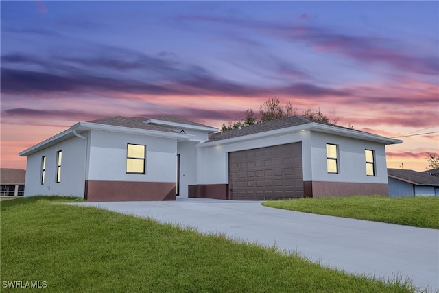 modern home with a yard and a garage