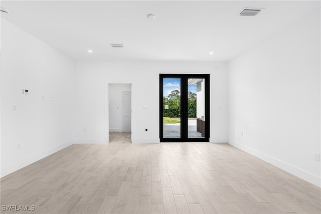 unfurnished room featuring light wood-type flooring