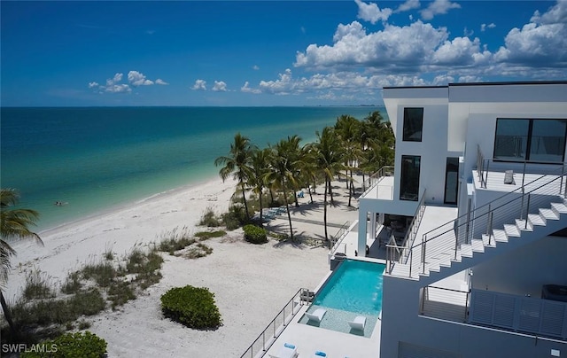 27804 Hickory Blvd, Bonita Springs, FL 34134 - view of swimming pool with view of water and beach, stairs, and an infinity pool