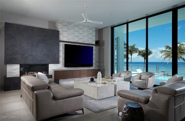 27804 Hickory Blvd, Bonita Springs, FL 34134 - living room with floor to ceiling windows, a ceiling fan, and a fireplace