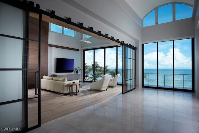 27804 Hickory Blvd, Bonita Springs, FL 34134 - tiled living area with a towering ceiling