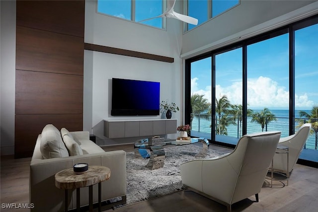 27804 Hickory Blvd, Bonita Springs, FL 34134 - living area featuring plenty of natural light, wood finished floors, and a high ceiling