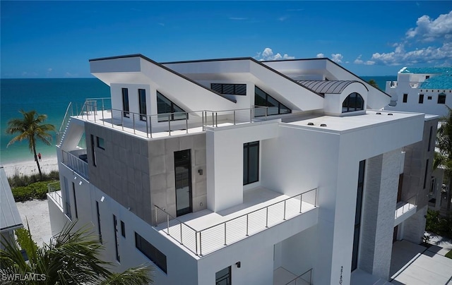 27804 Hickory Blvd, Bonita Springs, FL 34134 - view of side of home with a balcony, a water view, and stucco siding