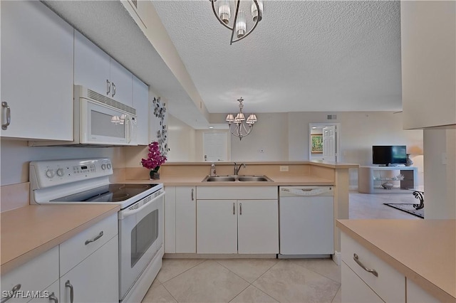 kitchen with pendant lighting, white appliances, sink, a textured ceiling, and white cabinetry