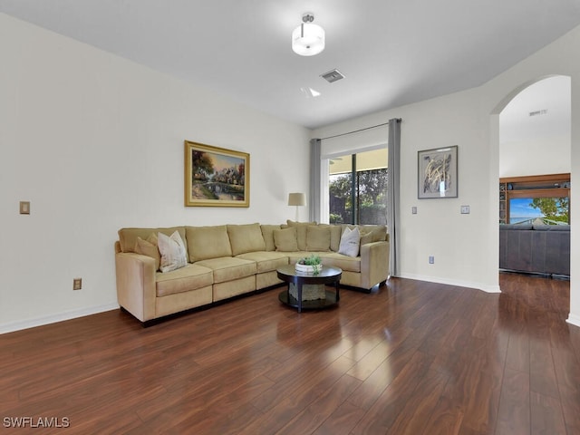 living room with dark hardwood / wood-style flooring