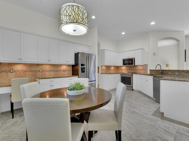 dining space with sink