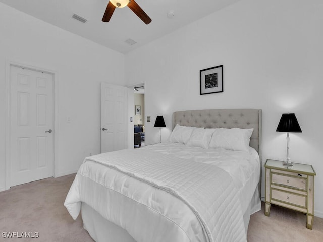 bedroom with light carpet and ceiling fan