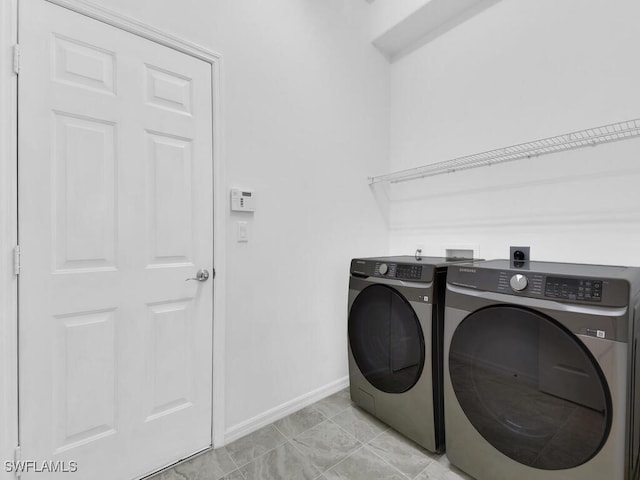 laundry room with independent washer and dryer