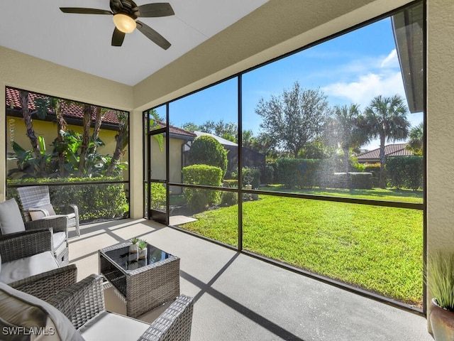 sunroom featuring ceiling fan