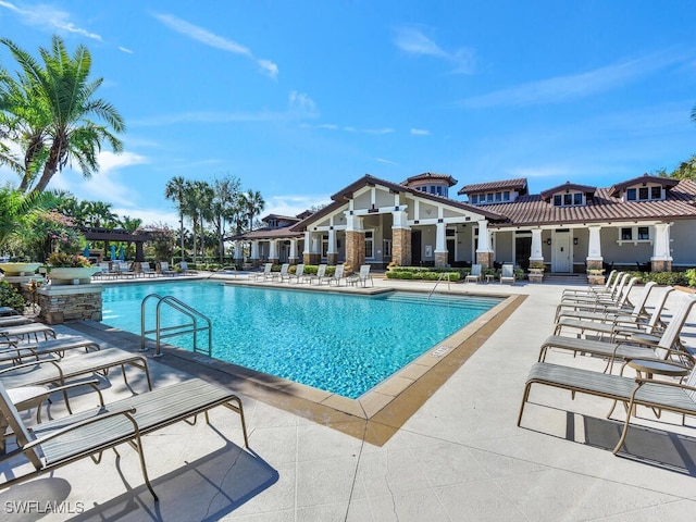 view of swimming pool featuring a patio area