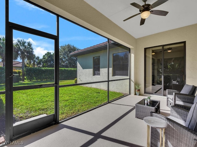 sunroom / solarium with ceiling fan