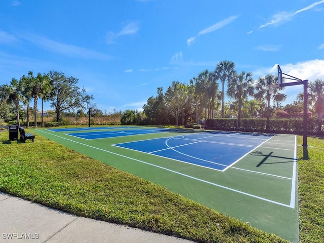 view of basketball court featuring a lawn