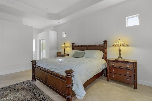 tiled bedroom featuring a raised ceiling and crown molding