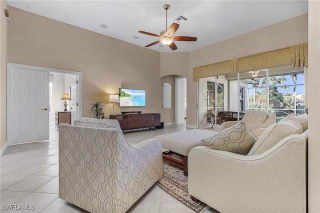 living room with ceiling fan and light tile patterned flooring