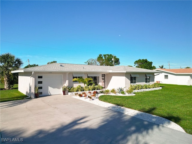 single story home with a front yard and a garage