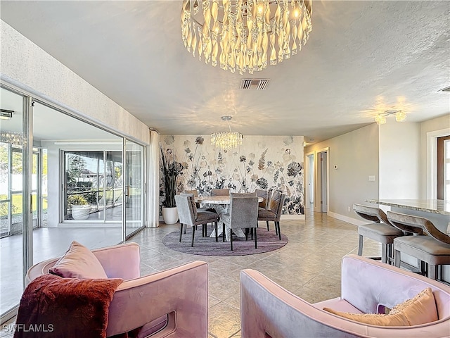 dining room featuring a healthy amount of sunlight and a chandelier