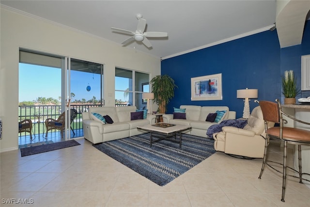 living room featuring light tile patterned floors, ceiling fan, and crown molding