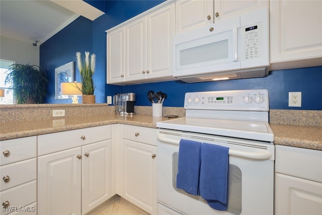 kitchen with crown molding, white cabinets, light tile patterned flooring, and white appliances