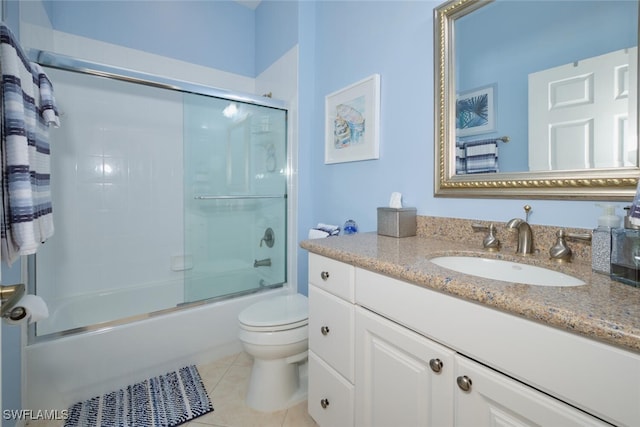 full bathroom with tile patterned flooring, vanity, toilet, and enclosed tub / shower combo