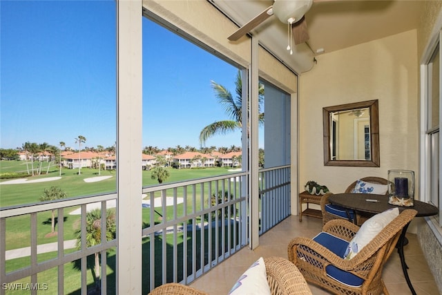 balcony featuring covered porch and ceiling fan