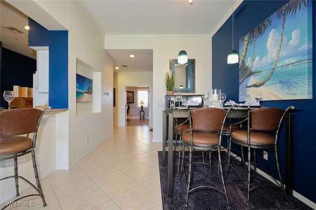 tiled dining area with crown molding