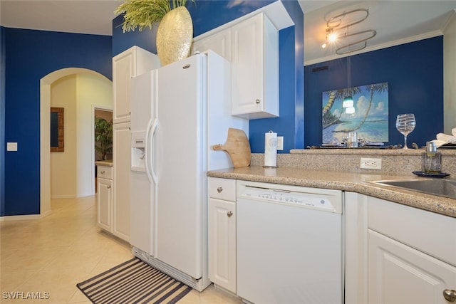 kitchen featuring white appliances, white cabinets, sink, crown molding, and light tile patterned floors