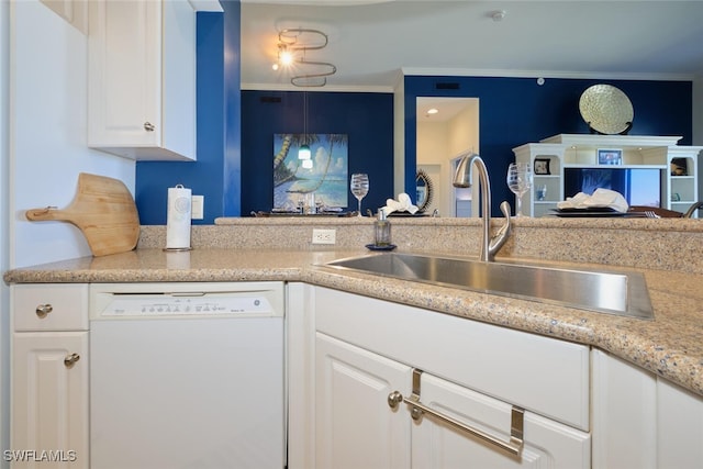 kitchen featuring white dishwasher, sink, crown molding, light stone counters, and white cabinetry