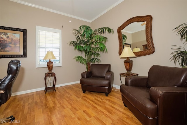 sitting room featuring light hardwood / wood-style flooring and crown molding