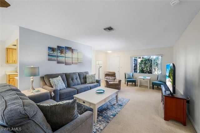 living room featuring light carpet