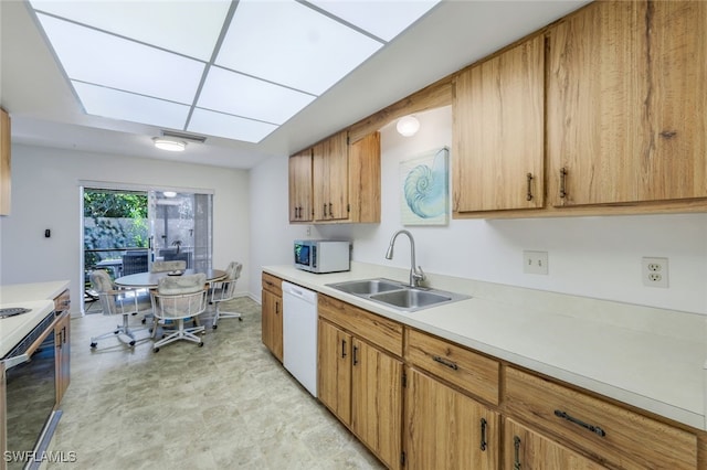 kitchen with white appliances and sink