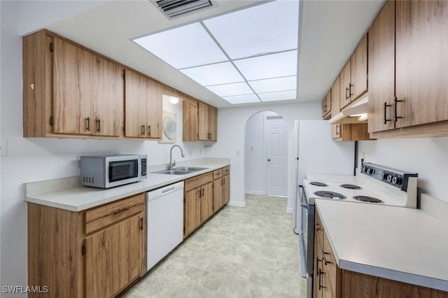 kitchen with sink and white appliances