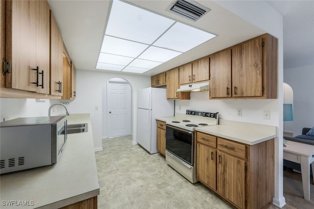 kitchen with sink and white appliances