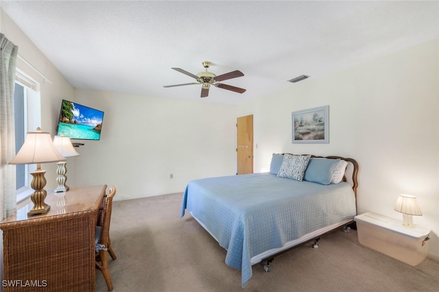 carpeted bedroom with ceiling fan