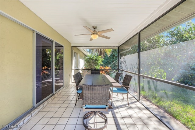 unfurnished sunroom with a wealth of natural light and ceiling fan